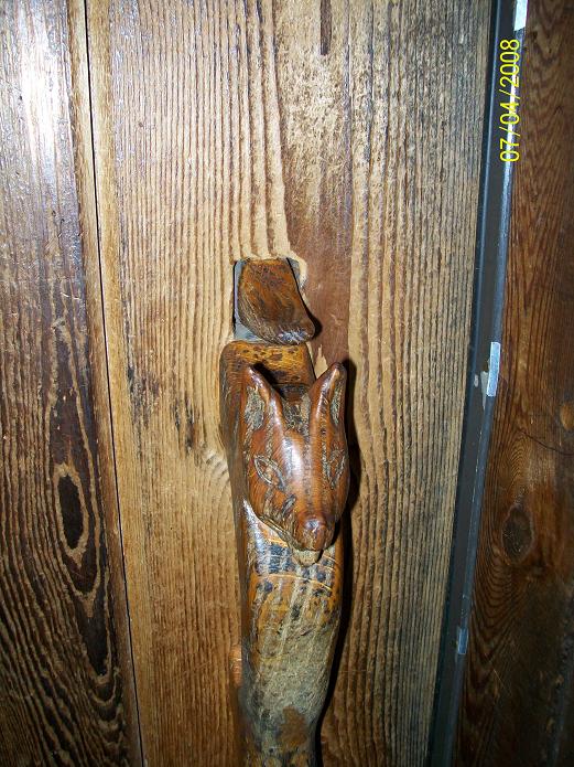 picture of door handle shaped like a wolf's head